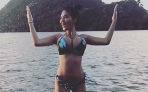 Faii Orapun at the beach in bikini